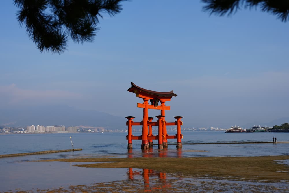 The floating torii gate at Miyajima standing in the shallows at low tide